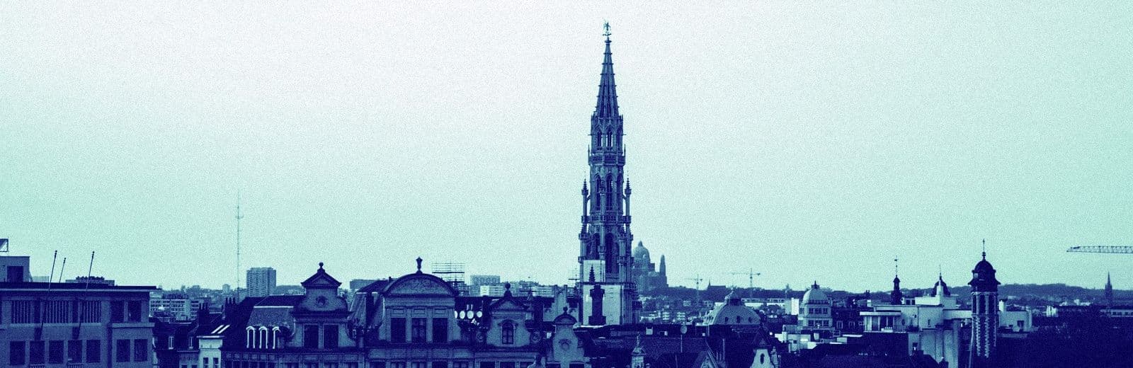 Brussels skyline in editorial duotone: the European jurisdictions this tracker follows